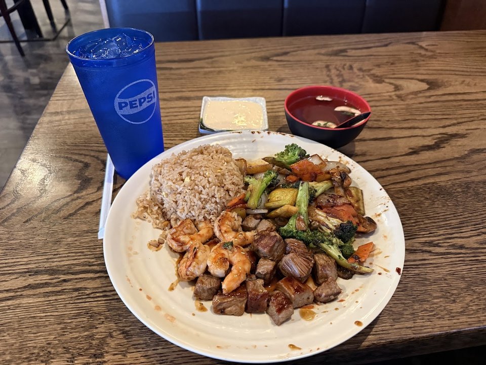Hibachi grill setup with hot cooking surface.