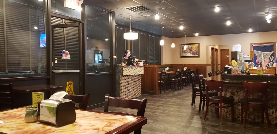 Casual restaurant seating with table service.
